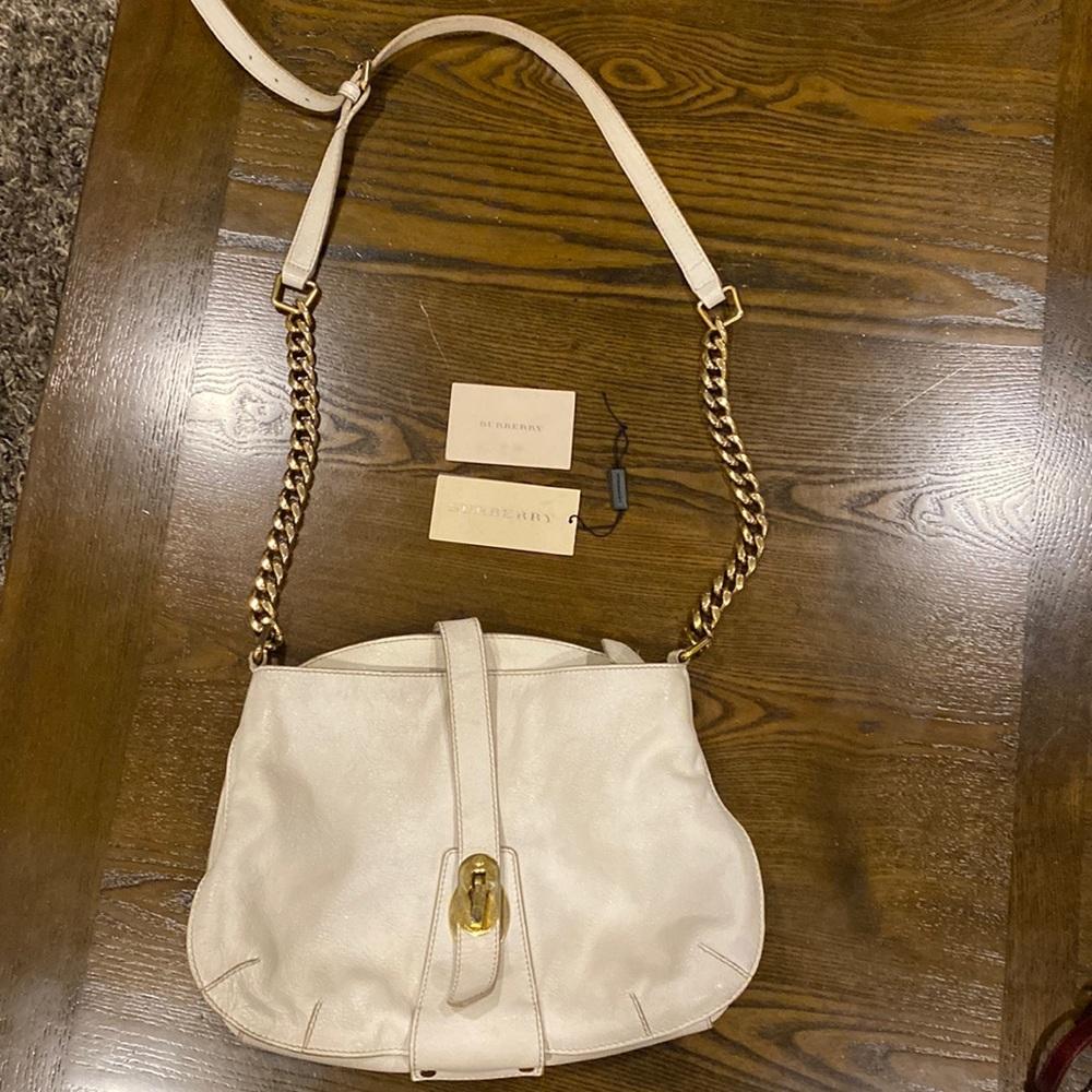Authentic Burberry white leather purse with gold chain.